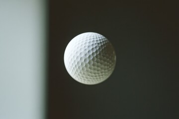 A white golf ball soaring through the air, great for sports or outdoor scenes