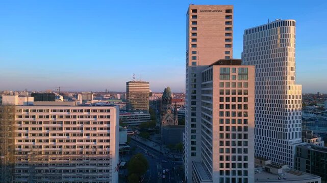zoologischer garten train station and surrounding urban landscape in berlin, germany during sunset. Magic aerial view flight panorama overview drone