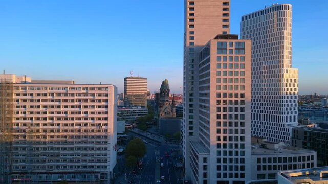 zoologischer garten train station and surrounding urban landscape in berlin, germany during sunset. Great aerial view flight speed ramp hyper motion time lapse