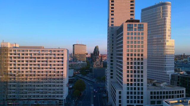 zoologischer garten train station and surrounding urban landscape in berlin, germany during sunset. Lovely aerial view flight
