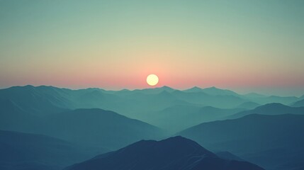 Sunrise over a misty mountain range with soft pastel colors creating a calming and peaceful atmosphere with side empty space for text Stockphoto style