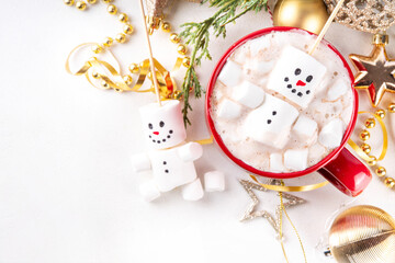 Christmas hot chocolate with funny snowman made with marshmallows