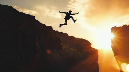 Silhouette of a man leaping across a gap between two hills, mid-air as he jumps over a cliff, Courage and determination	
 - Powered by Adobe