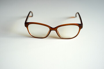Close-up of brown new glasses against white background. Photo taken November 14th, 2024, Zurich, Switzerland.