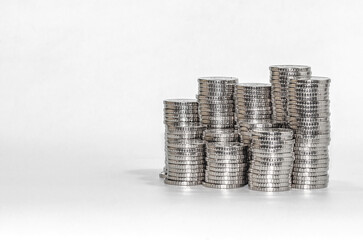 Front view columns of silver coins. Isolated on white. Idea of business and finance. Copy space.