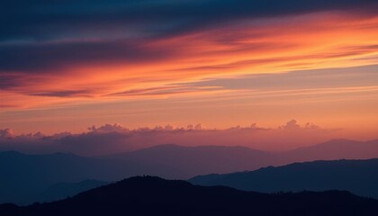 Obraz premium view of a mountain range with a colorful sky