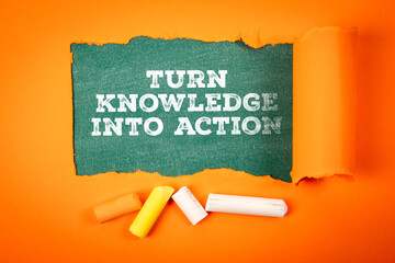 Turn knowledge into action. Text under torn orange paper on a green chalkboard