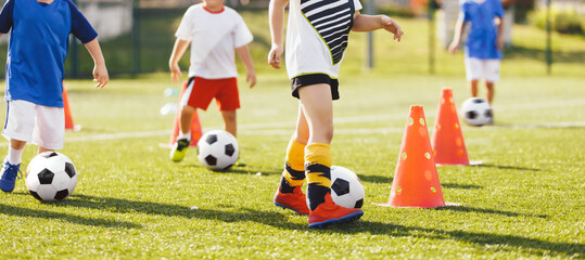 Football Training for School Boys. Physical Education Class for Children. Young Coach With Kids in Team on Training Unit. Youth Team Coach Training School Boys in Football Soccer