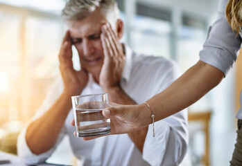 Business, hand and headache of mature man in office with help from assistant or employee. Glass,...