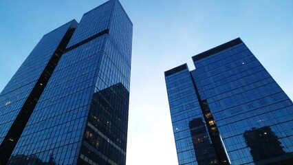 Modern urban landscape, early evening, glass facades