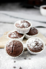 Chocolate muffins with sugar. on a gray background.dessert
