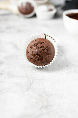 Chocolate muffins with sugar. on a gray background.dessert