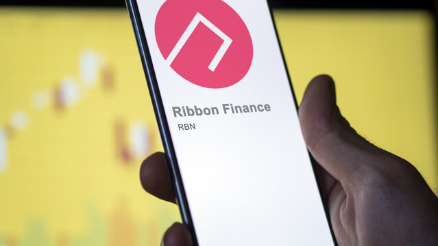 Close up on logo of RBN Ribbon Finance on the screen of an exchange. RBN Ribbon Finance price stocks, $RBN on a device.