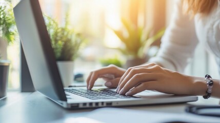 Focused professional working on a laptop in a modern workspace