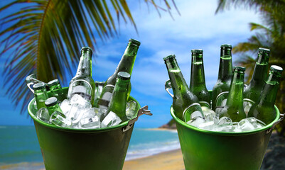 cold bottles of beer in bucket with ice