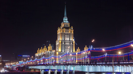Fototapeta premium Hotel Ukraine winter night timelapse hyperlapse with bridge over Moscow River.