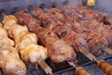 Kebabs on skewers are grilled on hot coals