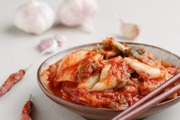 Kimchi is a dish of Korean cuisine made of cabbage and pickled (fermented) vegetables with red hot pepper and garlic. Close-up, selective focus