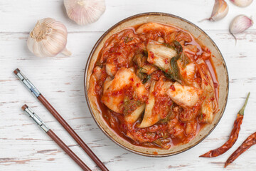 Kimchi is a dish of Korean cuisine made of cabbage and pickled (fermented) vegetables with red hot pepper and garlic. Close-up, selective focus