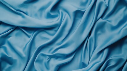 Fototapeta premium A close-up view of smooth, flowing turquoise fabric, showcasing its rich texture and elegant drape.