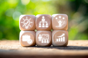 Wooden blocks with icons symbolize learning and leadership, showcasing growth, strategy, and...