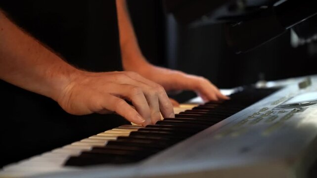 Close-up shots capture a musician's hands skillfully playing a keyboard synthesizer, showcasing talent and creativity