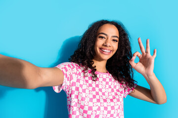 Photo of adorable lovely girl wear print t-shirt taking selfie showin gokey winking eye empty space...