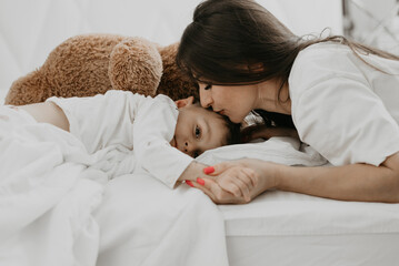 Loving mother kissing her son