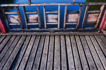 Texture of a wooden bridge that is often exposed to water and sun