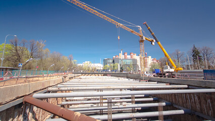 A large huge ditch pit tunnel timelapse hyperlapse at the construction site of the underground metro station line.