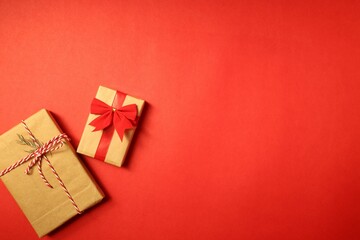 Christmas gifts, presents on a red background with ribbons. New year is coming