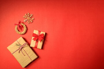 Christmas gifts, presents on a red background with ribbons. New year ornaments. New year is coming