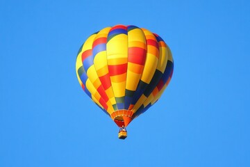 Fototapeta premium Vibrant Hot Air Balloon Ascending in a Clear Sky