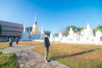 Beautiful photographer backpack women take photo travel in buddha temple