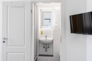 modest toilet with bathtub in a hotel room