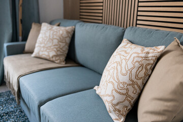 close-up, modern sofa in a minimalist interior of a hotel, living room, cozy corner © Kateryna Muzhevska
