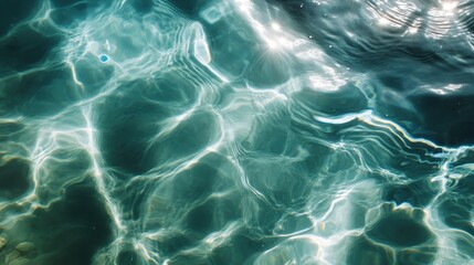 A captivating scene of sunlight dancing on vibrant turquoise water, creating delicate patterns and evoking a sense of peace and serene natural ambiance.