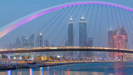Pedestrian Bridge over the Dubai Water Canal day to night timelapse, United Arab Emirates