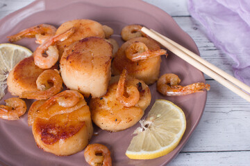 fried scallops on a plate, seafood. Serving dishes in the restaurant