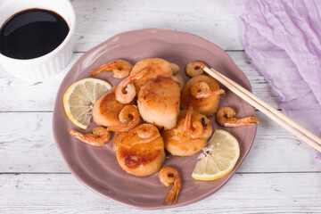 fried scallops on a plate, seafood. Serving dishes in the restaurant
