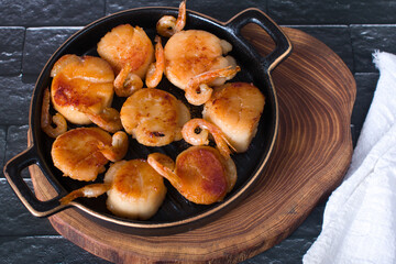 fried scallops on a plate, seafood. Serving dishes in the restaurant