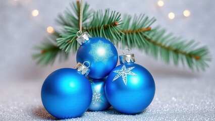Experience the Magic of Christmas with Shimmering Blue Ornaments and Pine Branches, Perfect for Festive Decorations and Holiday Cheer