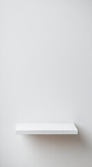 A single white shelf is mounted on a white wall. The shelf is empty and ready to be styled