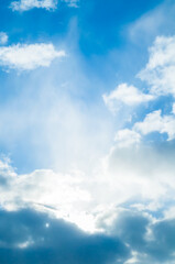 Obraz premium Cumulus clouds high in the blue sky, blue sky background with fluffy clouds