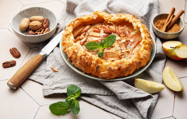 Delicious homemade apple galette with almond flakes and cinnamon