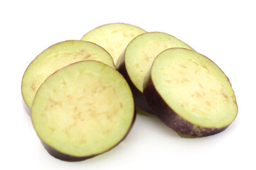 Aubergine, Solanum melongena, egg plant, single ripe fruit and halved fruit next to it - stock photo	
