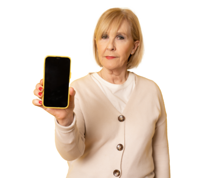 Portrait of a senior elder smiling woman showing or presenting mobile phone smartphone screen on hand isolated over transparent background.