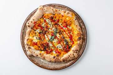 Italian white pizza, with pumpkin cream, tomato jam , olive powder, from above isolated on white background