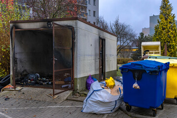 A shelter and garbage bins set on fire