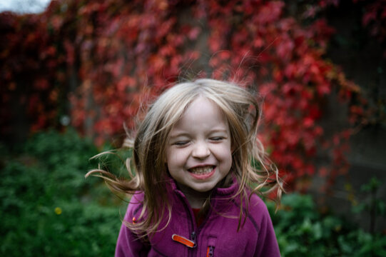 Naklejki Portrait of a Young Girl With Joyful Expression